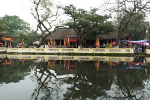 In front of the communal house is a large water shirt